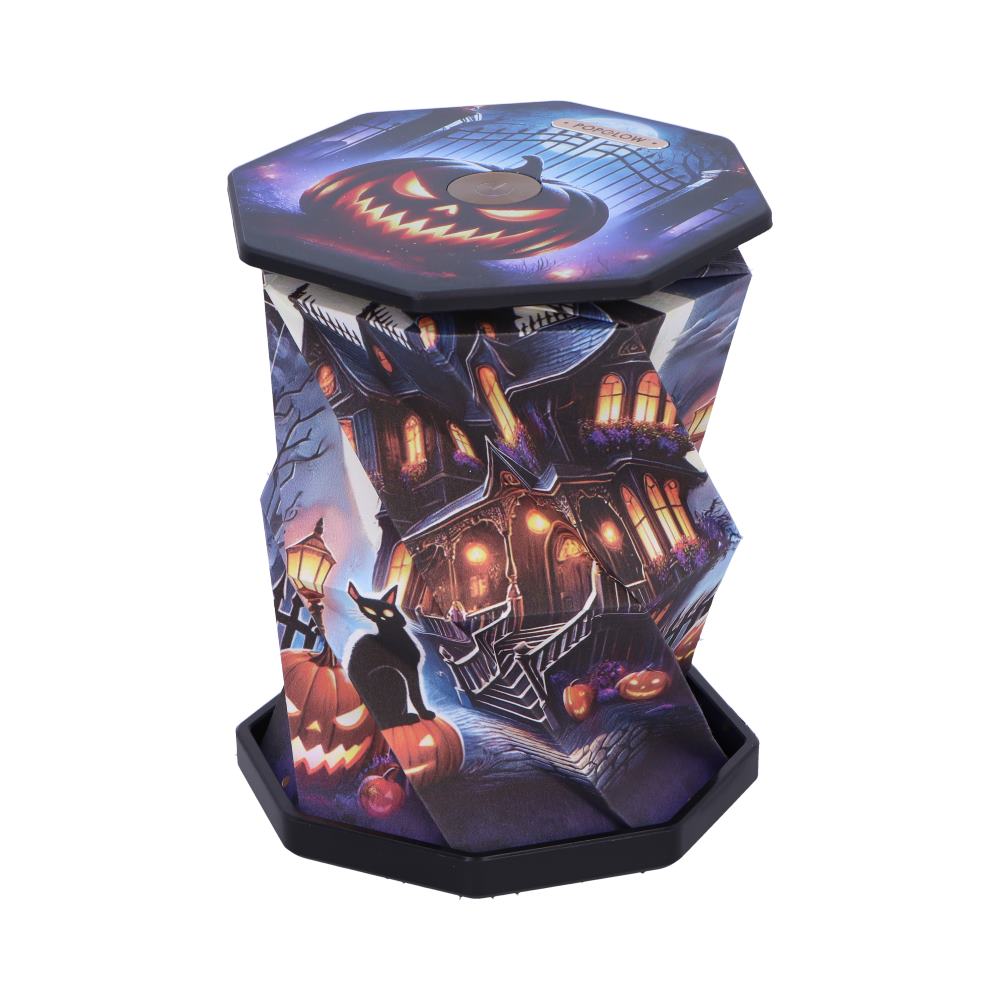 Halloween-themed haunted-house tissue dispenser with pumpkins and a black cat.