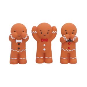 Three gingerbread figurines with white icing details; left covers eyes, middle raises arms, right covers mouth, all with bow ties and buttons