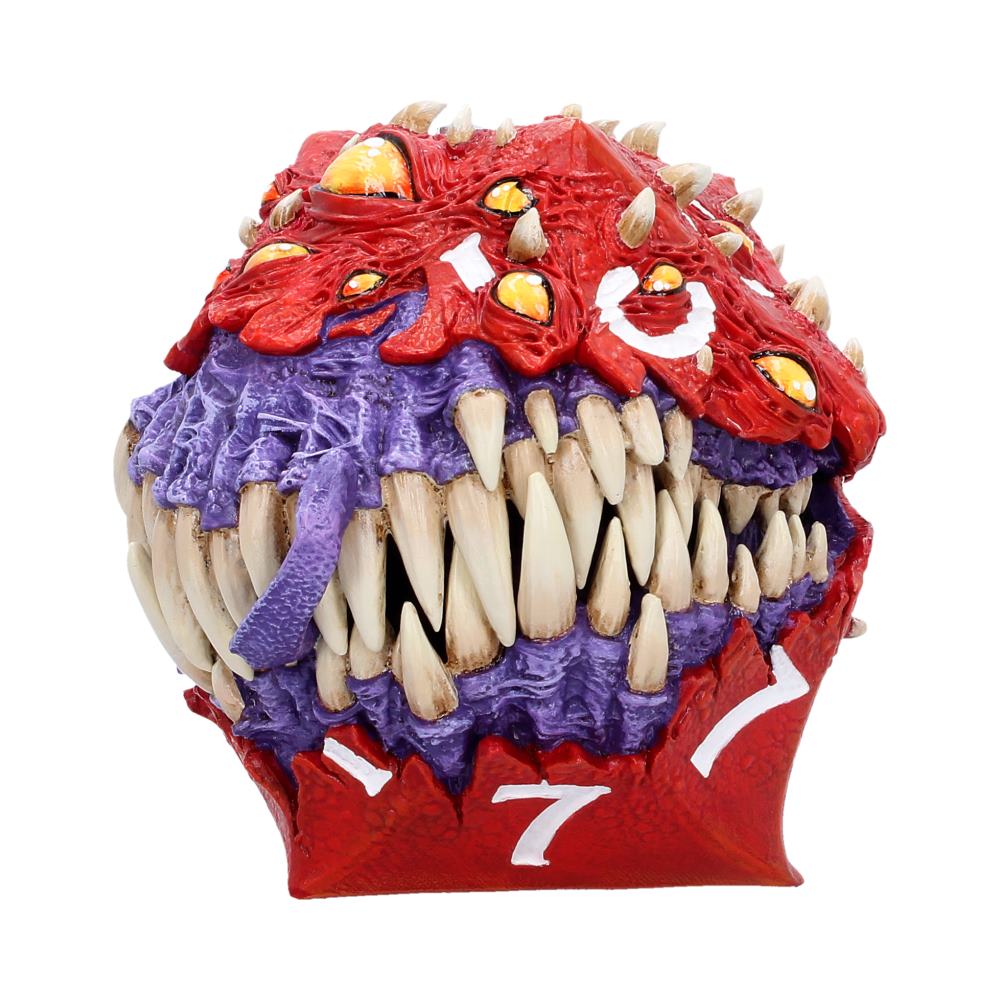 Red and purple monster head sculpture with large sharp teeth and yellow eyes, numbered 7 at the chin/neck area.