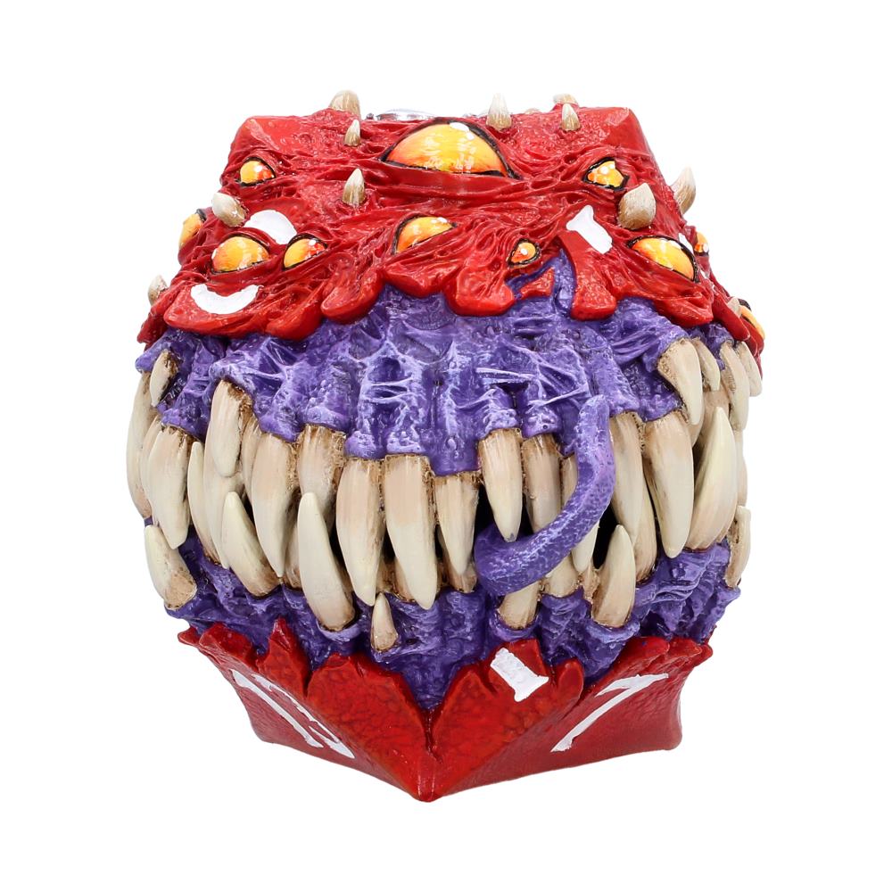 Colorful monster head sculpture with red and purple textures and many large ivory teeth, decorative art piece.