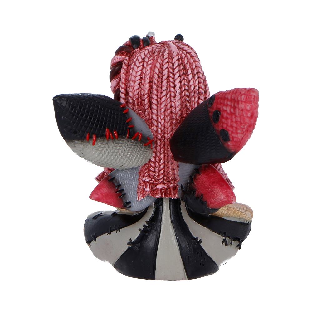 Back view of a patchwork plush toy with pink braided hair and red, black, and gray limbs.