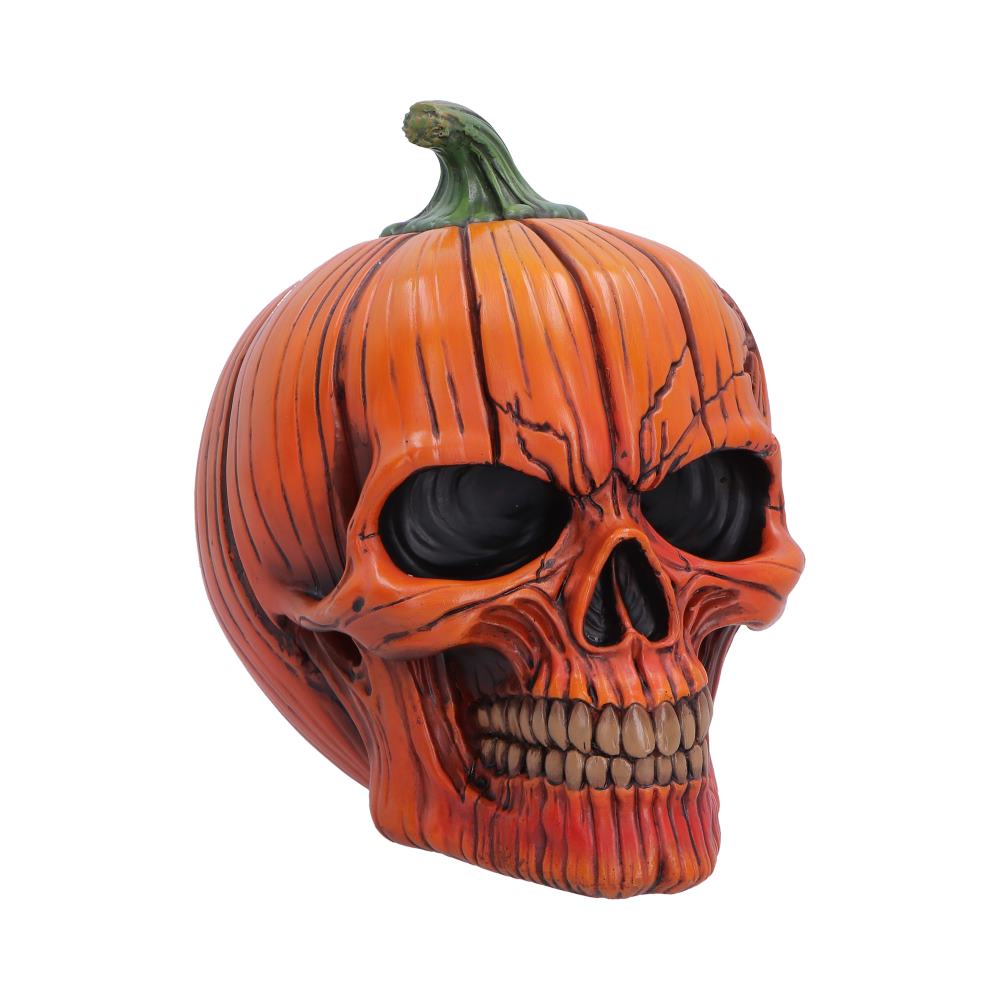 Halloween-themed orange pumpkin skull decoration with black eye sockets and detailed carved teeth