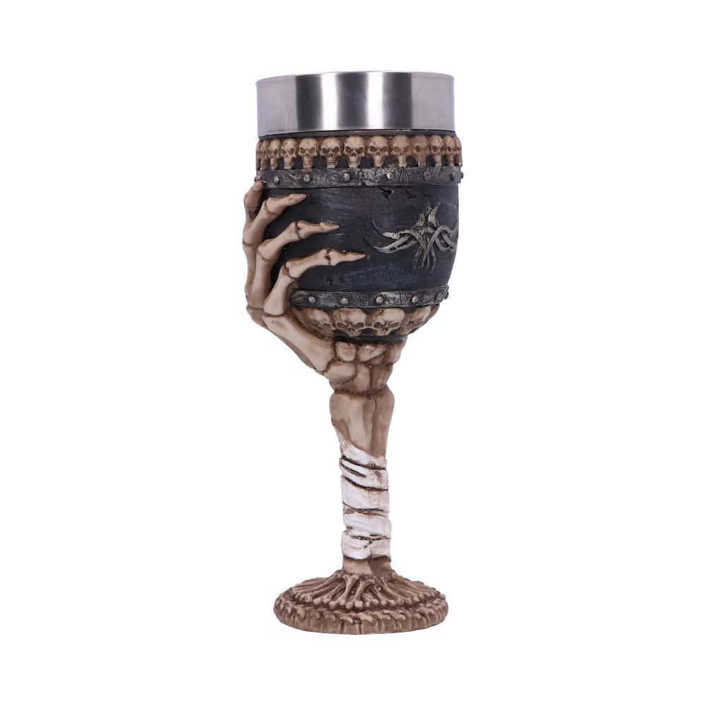Skeleton hand gripping a gothic chalice adorned with skulls and a metal rim, on a pale stem.