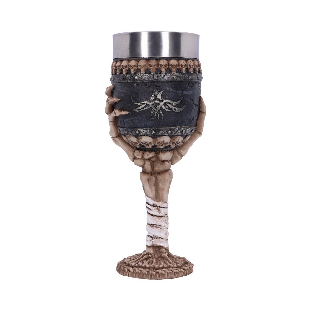 Gothic decorative goblet with a skeleton hand stem gripping a black cup edged with skulls.