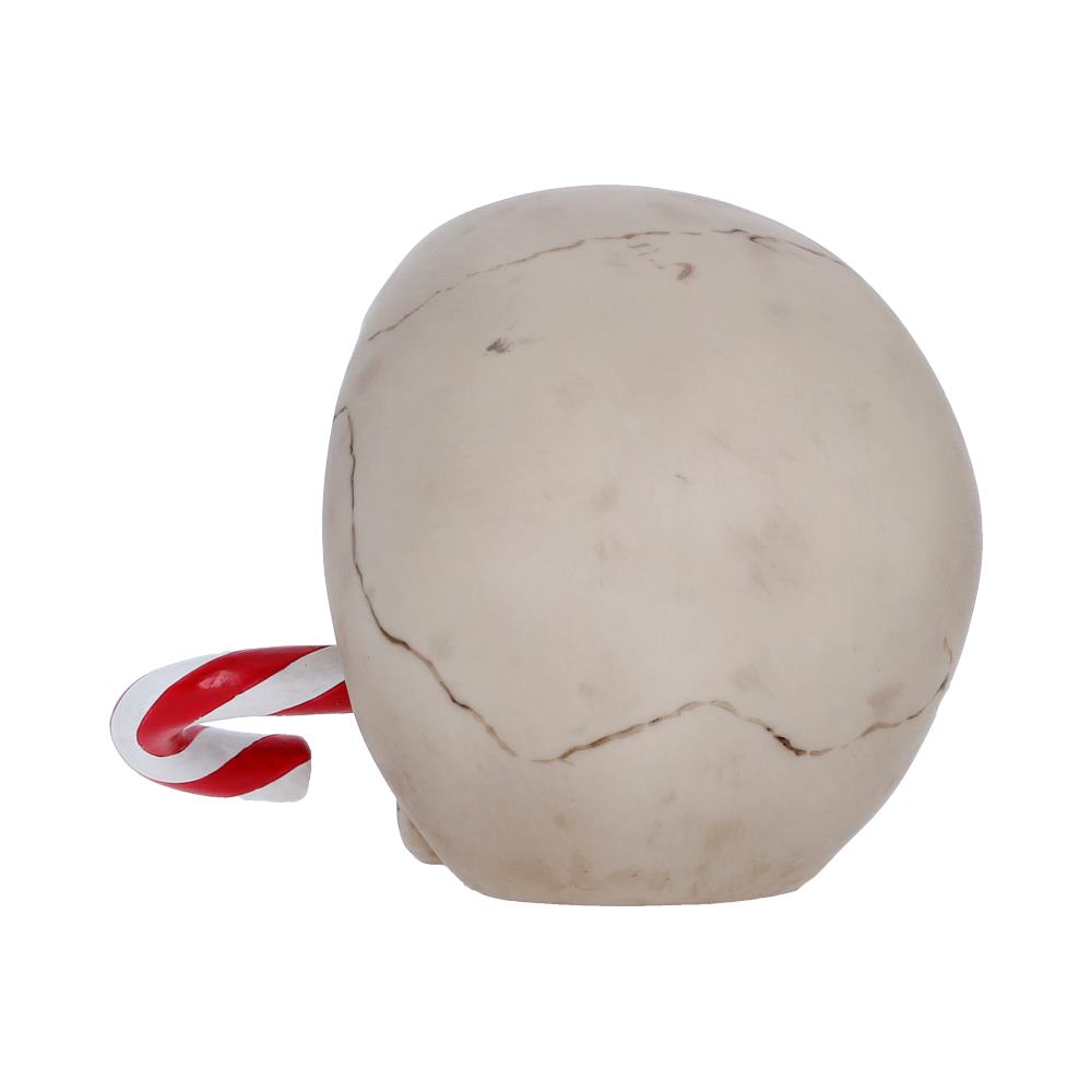 Round white marble-like ball with visible cracks and a red-and-white striped candy cane tucked behind it