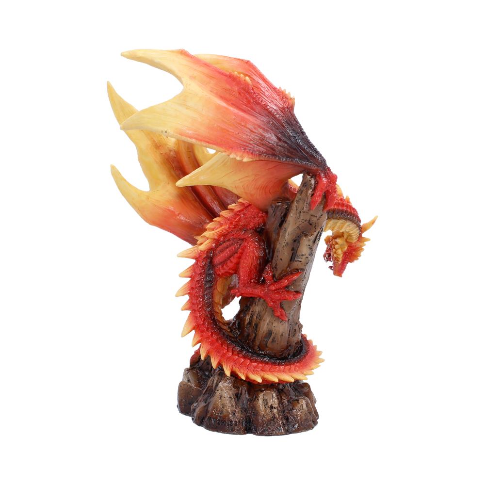 Red and orange dragon statue perched on a rocky pedestal, flames curling behind it.