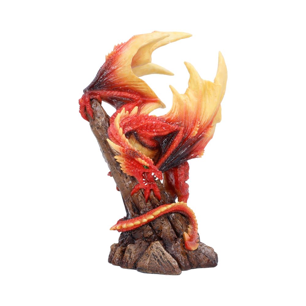 Red and yellow dragon figurine wrapped around a rocky base, flames curling from its wings in a dynamic pose