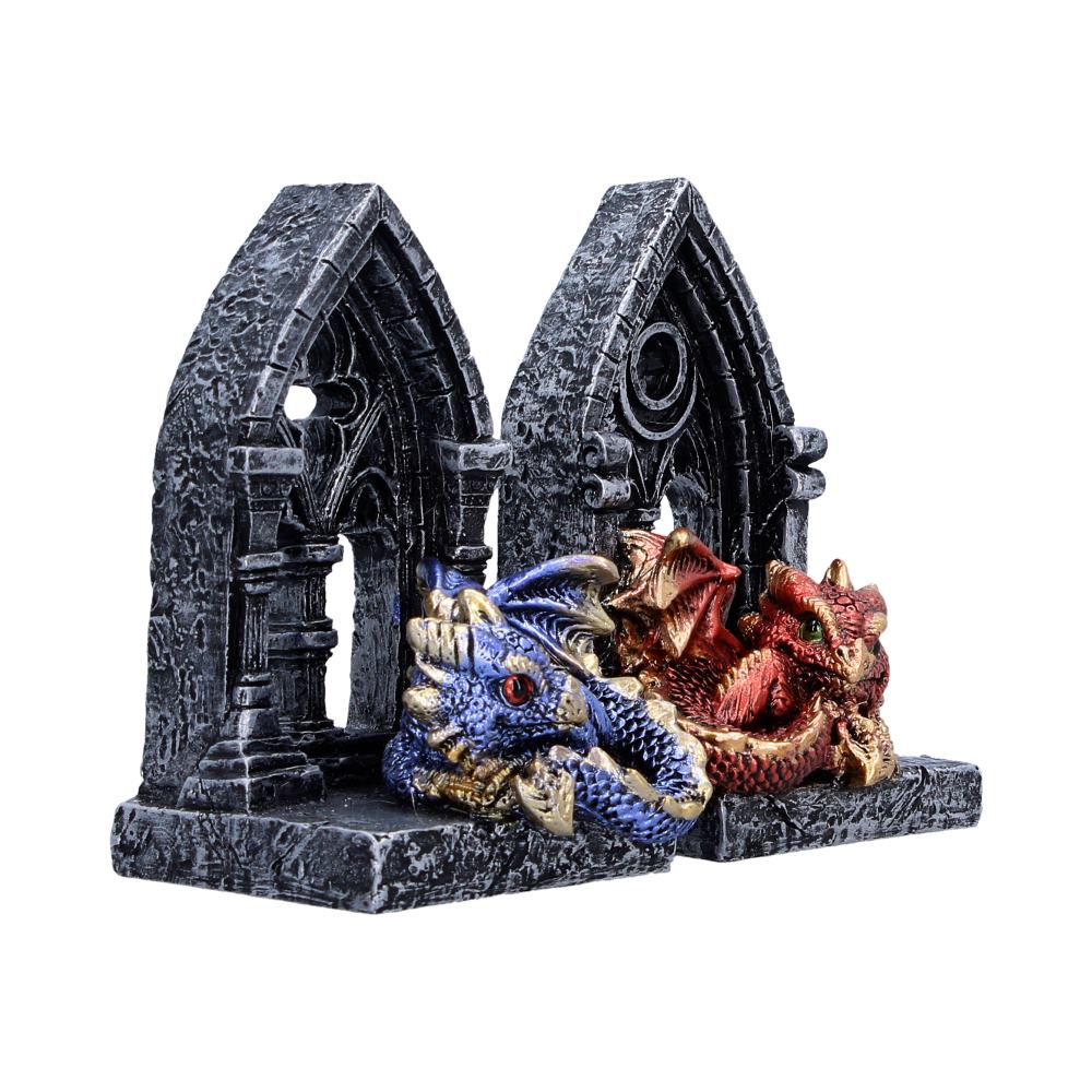 Two painted dragon heads (blue and red) emerging from a gray stone ruin on a rectangular base.