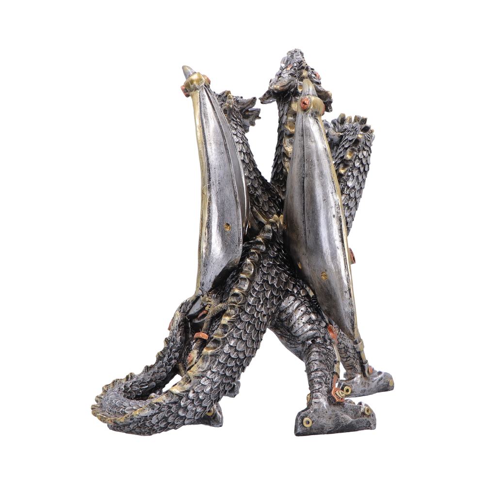 Two metal dragon sculptures standing back-to-back with wings spread.