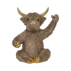 Bronze-colored, shaggy bull figurine with large horns, sitting and raising its right foreleg as if waving, with a small gold ball in its left paw.