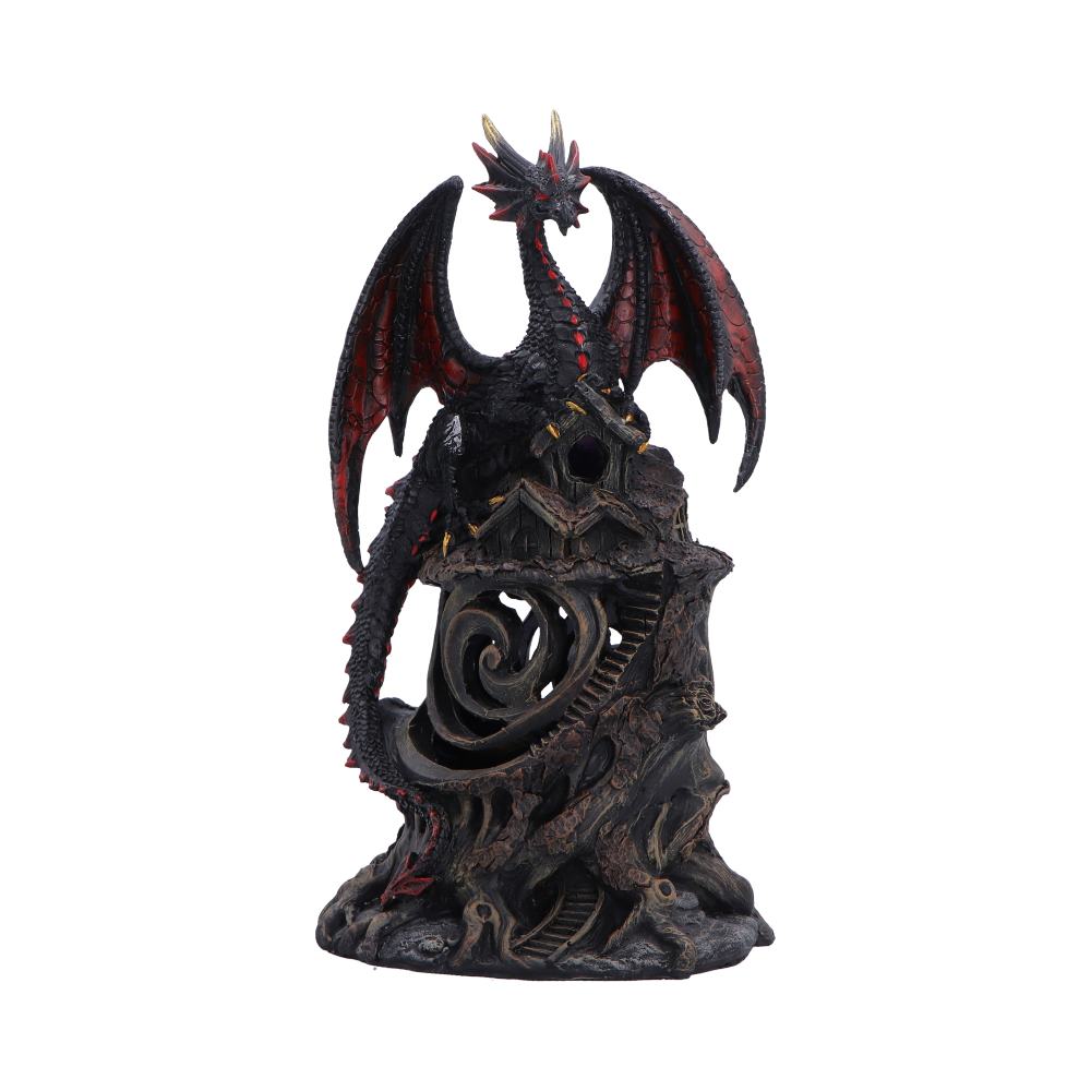 Dark dragon statue perched on a jagged rock pedestal with red-tinged wings and a spiraling carved interior; fantasy figurine centerpiece.