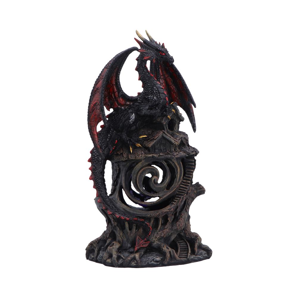 Black dragon figurine with red-tinted wings perched on a rocky pedestal, featuring a spiraled hollow center.