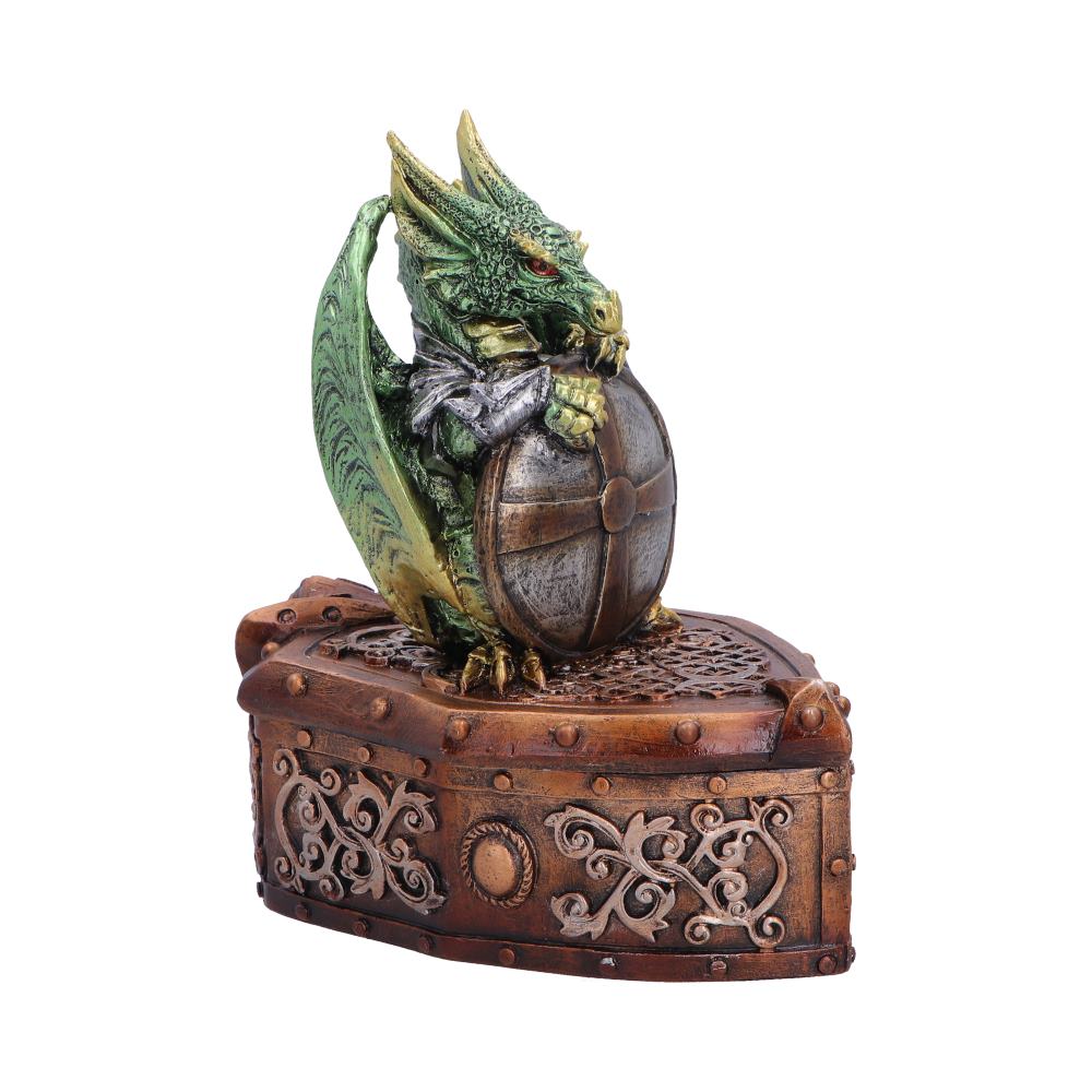 Green dragon figurine perched on a round metallic globe, resting on an ornate riveted wooden chest.