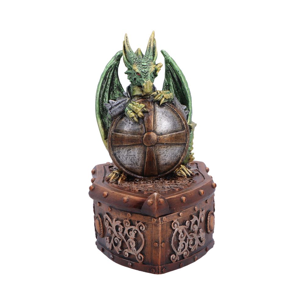 Green dragon figurine perched on a metallic globe resting on a carved ornate chest pedestal, decorative statue.