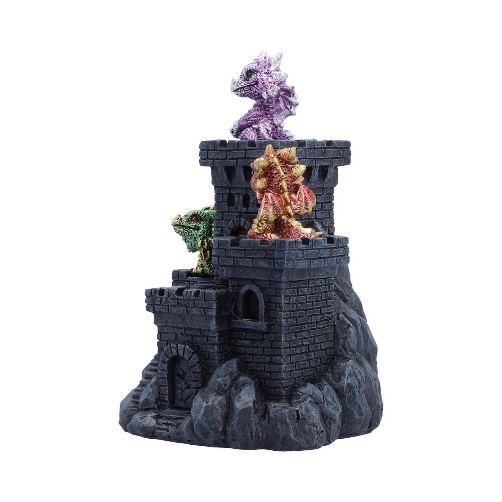 Castle tower model with three colorful dragon figurines on the battlements (purple, red, green) on a rocky base