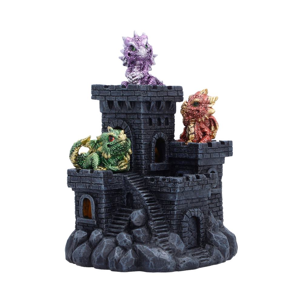 Dark gray toy castle with three colorful dragon figurines perched on its towers (purple on top, red on the right, green on the left) atop a rocky base.